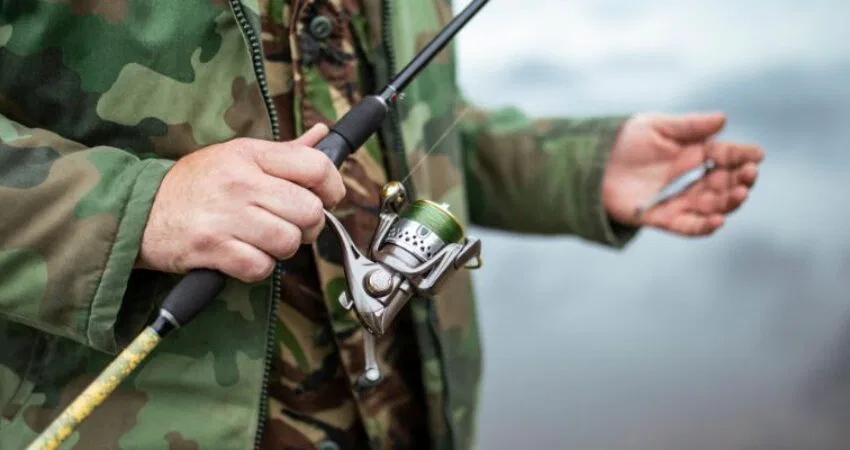 The man holds one of the most expensive fishing rods in the world.