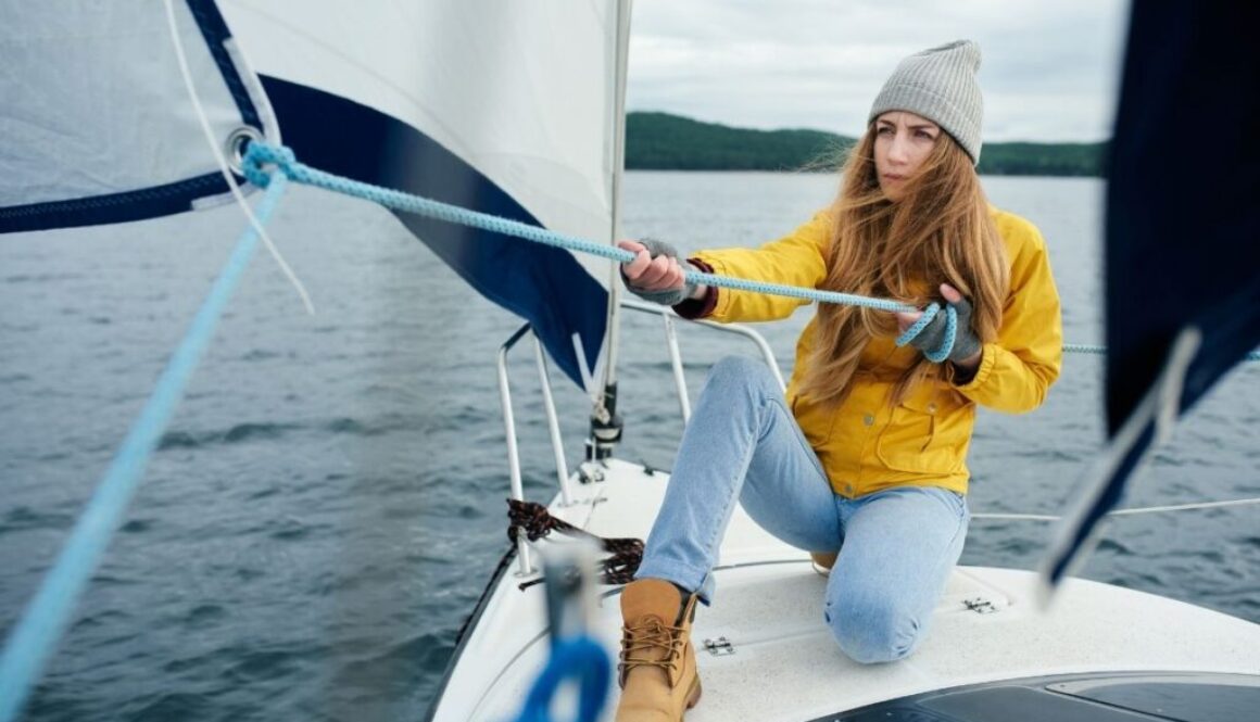 Young beautiful women first time sailing