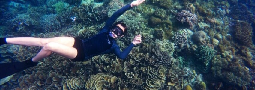 Snorkel expert looking at the underwater camera