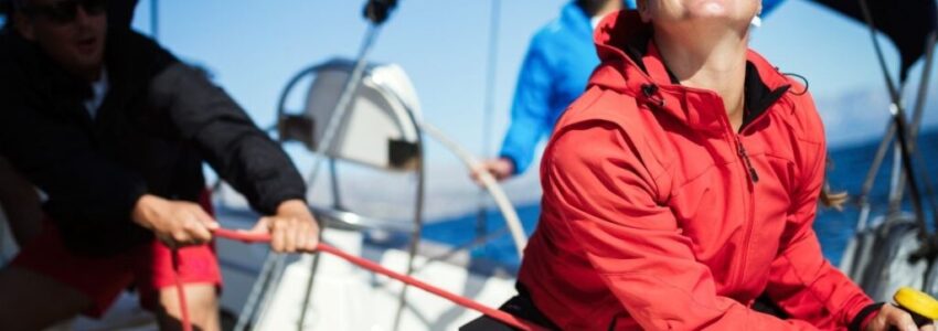 A group of adult people wearing a gears for sailing