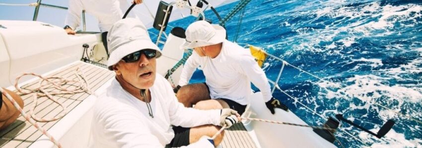 A man on a sailing boat after getting his sailing license.