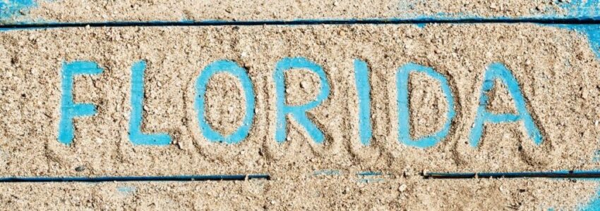 The word "Florida" written in white sand.