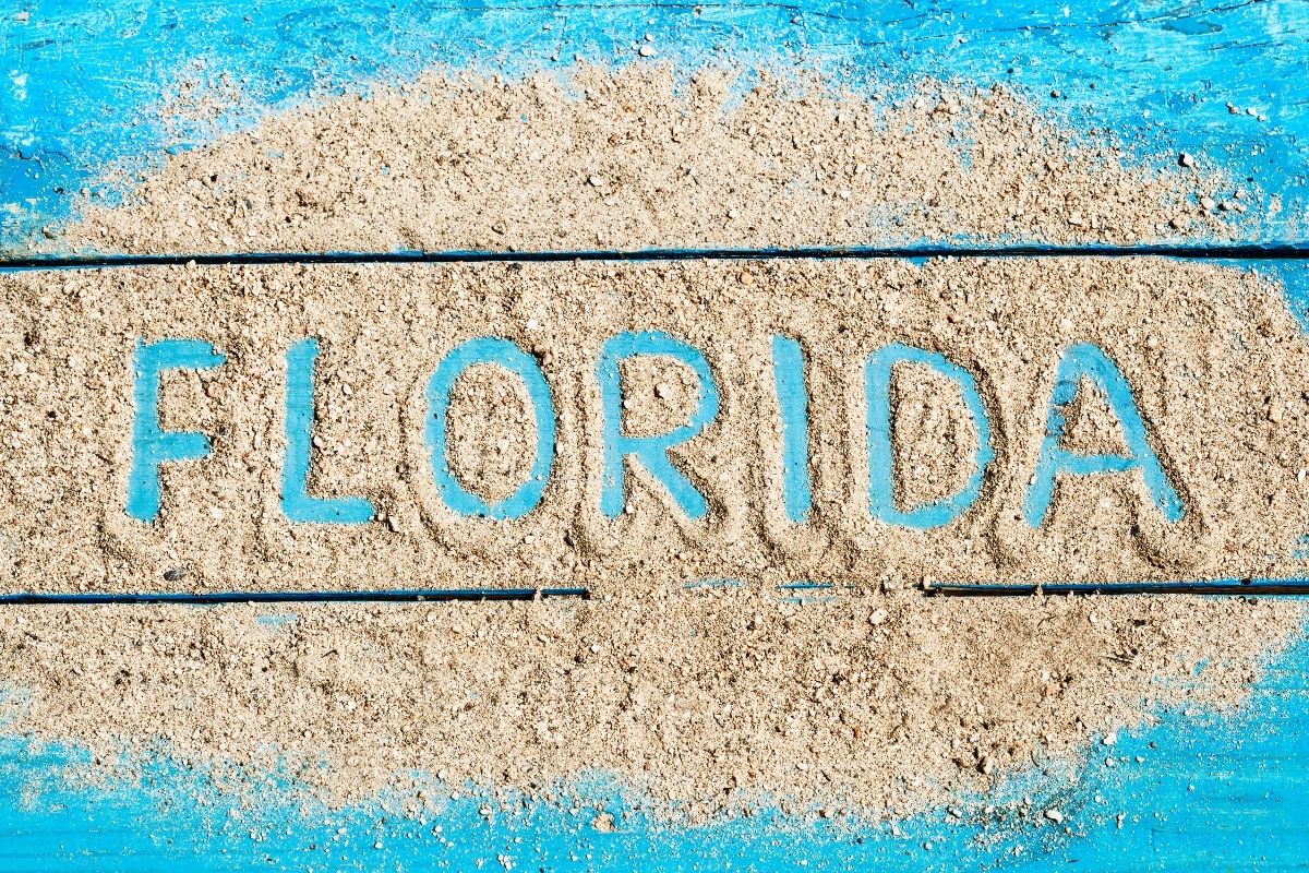 The word "Florida" written in white sand.