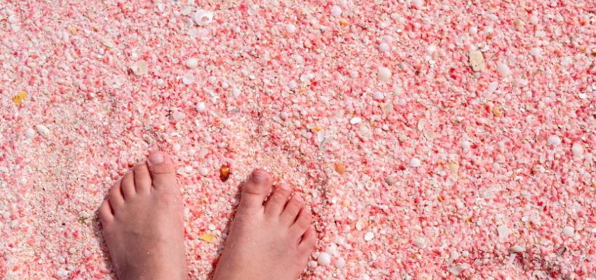 Someone stepping on pink sand.