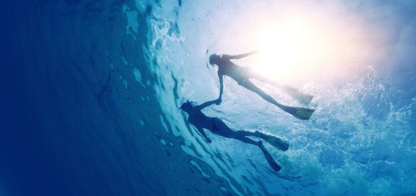 The two pregnant women went snorkeling together.