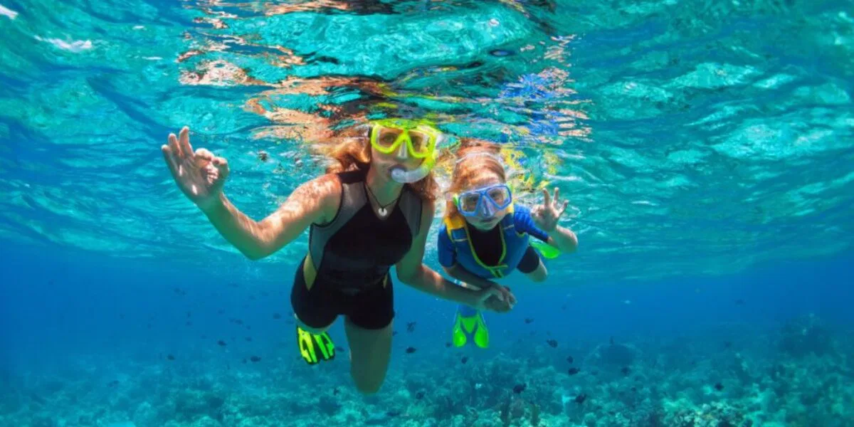 A mother and child snorkeling in Nassau. 