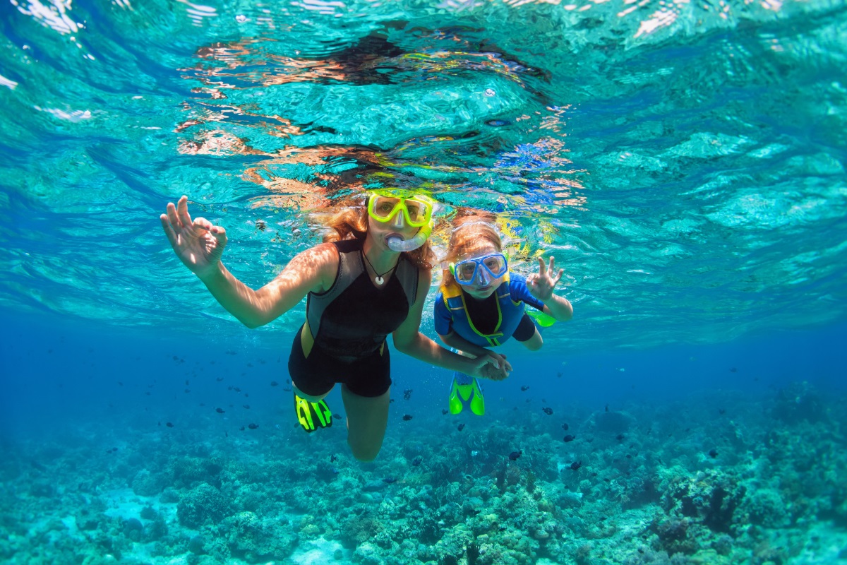 A mother and child snorkeling in Nassau.