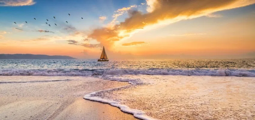 The boat is sailing on the sea.