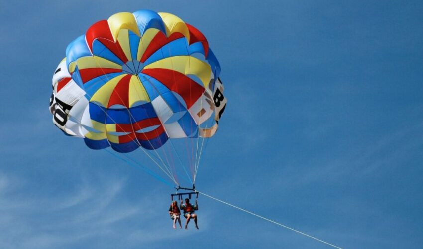 A couple do parasailing in Pensacola.