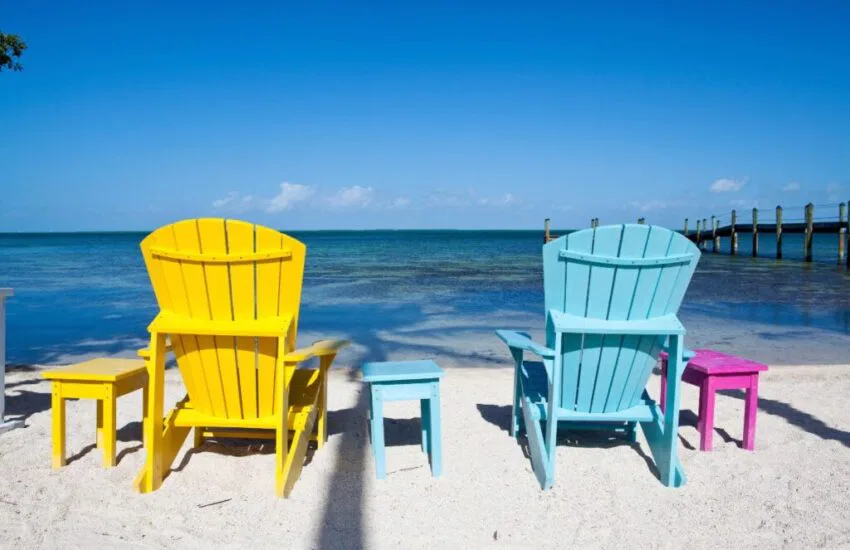The set of wooden chairs in front of Key Largo Beach.