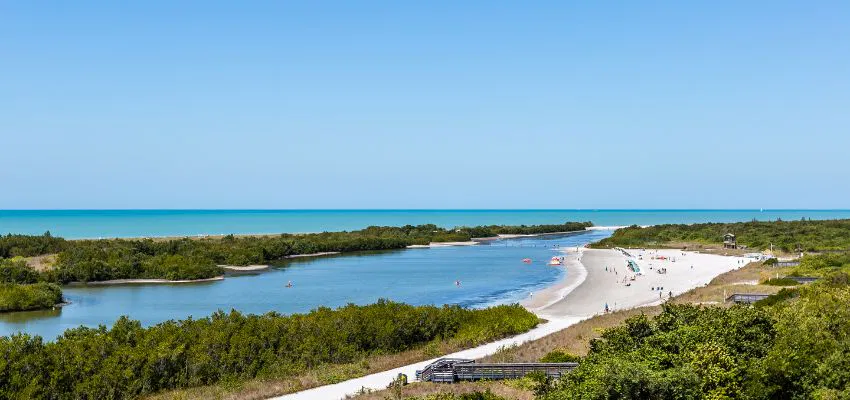 Marco Island, located 20 miles south of Naples, Florida, attracts visitors with luxury resorts and natural habitats.