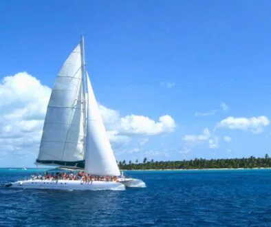 People are sailing on a Catamaran boat.