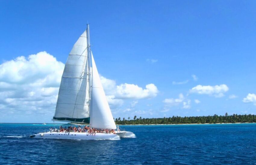 are catamarans faster than monohulls (2) People are sailing on a Catamaran boat.