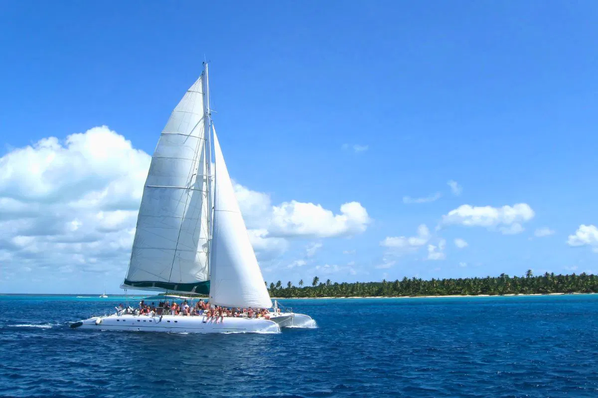 People are sailing on a Catamaran boat.
